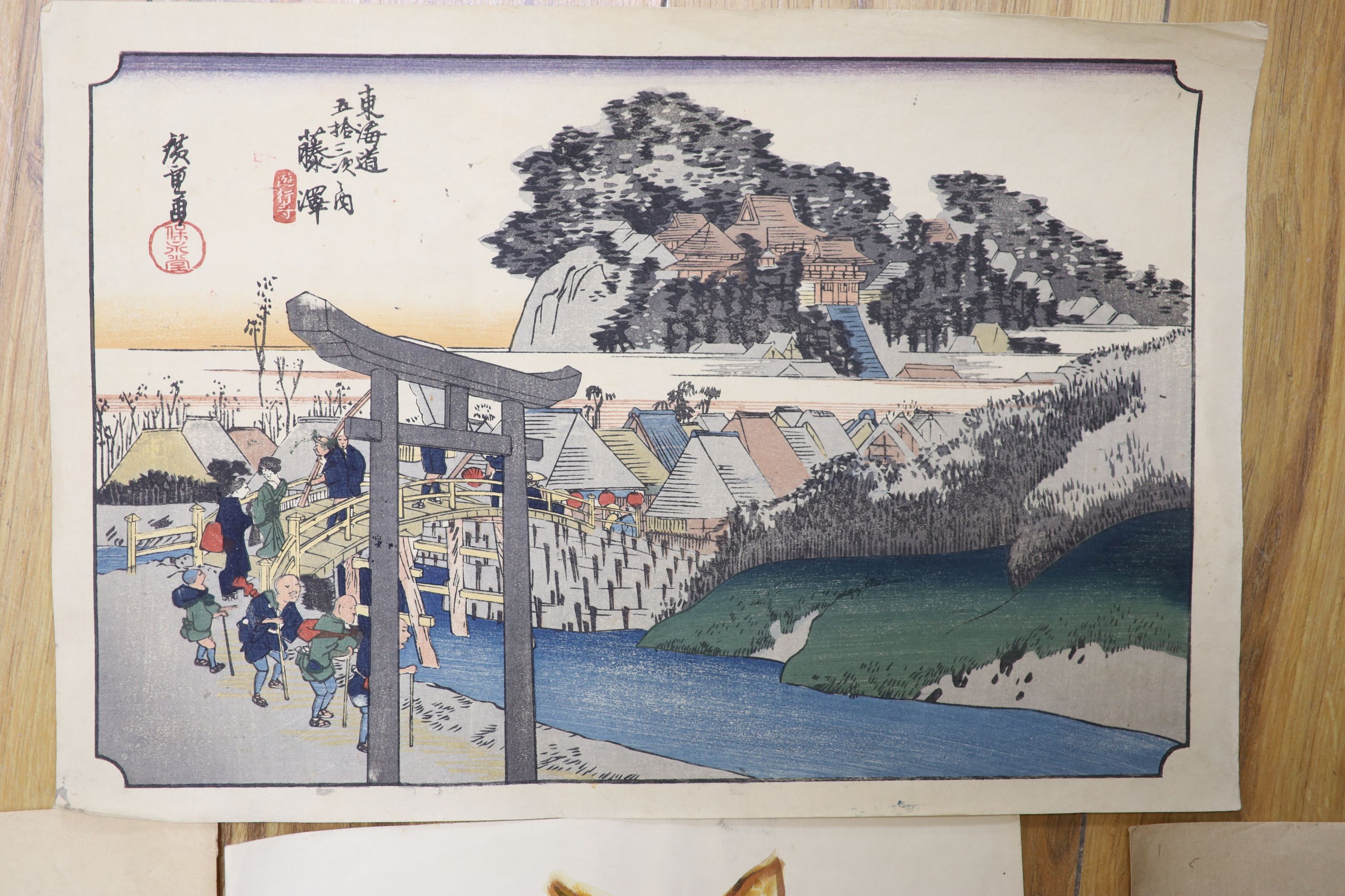 Japanese School, three woodblock prints, Warriors before Mount Fuji and other scenes, together with a watercolour of a cat, largest 38 x 25cm, unframed